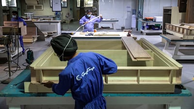 Skilled carpenters create fixtures and fittings for the interior of one of Gulf Craft's luxury yachts.