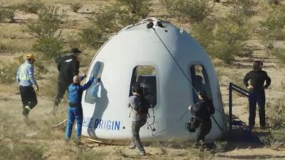 Billionaire Jeff Bezos gives a thumbs-up outside the capsule of Blue Origin’s New Shepard mission NS-18 after it landed by parachute near Van Horn, Texas. Reuters