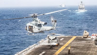 A US Marines UH-1Y Venom helicopter takes off from the flight deck of the US Navy amphibious assault ship USS Boxer during its transit through the Strait of Hormuz. Reuters