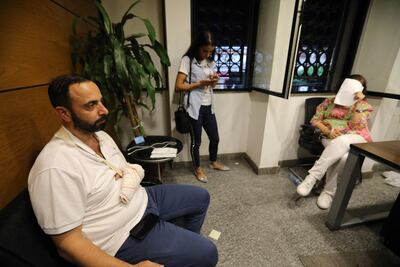 Abed Soubra, a depositor who stormed the Blom Bank branch in Beirut's Tariq Al Jdideh neighbourhood, demanding to withdraw his savings, is pictured inside the bank, after he surrendered his weapon to security forces, and said he planned to remain in the bank until he got his funds. AFP