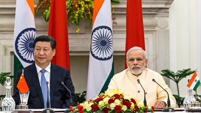 India's Prime Minister Narendra Modi and China's President Xi Jinping in Delhi. Bloomberg