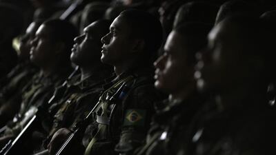 Army soldiers listen to instructions during the operation named ‘Agata’ near the town of Oiapoque, on the border with French Guiana. Ueslei Marcelino / Reuters