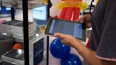 The Apple iPad has arrived, but at twice the US price.