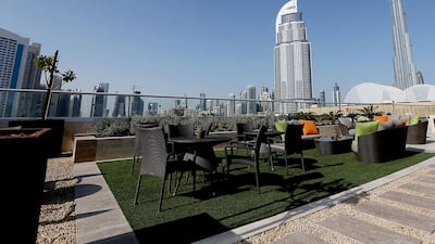 The pool and garden area of the penthouse apartment overlooking Burj Khalifa and The Dubai Mall. Satish Kumar / The National