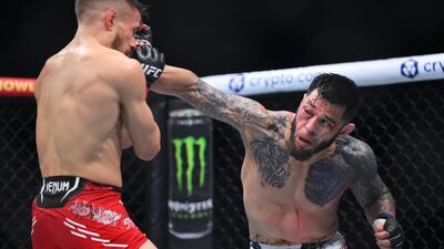 Daniel Pineda of the US punches Nathaniel Wood of England in a featherweight bout. Wood took the victory by decision. Getty Images