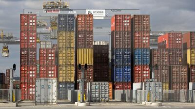 Shipping containers sit on the dock. Global trade is showing signs of bouncing back from pandemic-induced slump, however, a complete recovery will take longer as countries battle second and third waves of Covid-19, according to the WTO. AFP
