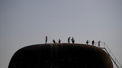 Demonstrators on the roof of The Egg, an abandoned cinema building in Beirut that is now showing films once again. Reuters