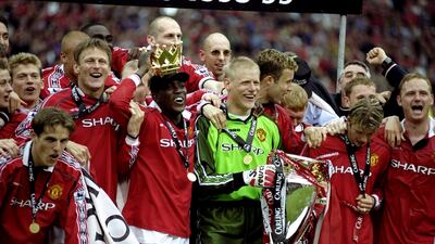 Manchester United players celebrate winning the title in the 1998-99 season with 79 points. Allsport