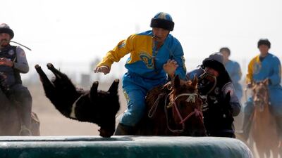 Kazakh and US horsemen take part in kok-boru. EPA
