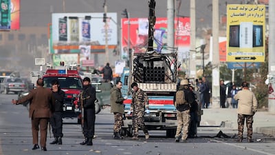 Security personnel inspect a damaged vehicle which was carrying and shooting rockets, in the aftermath of a rocket attack in Kabul, Afghanistan. According to media reports at least three people were killed and 11 others were injured as multiple rockets landed on the Afghann capital. EPA