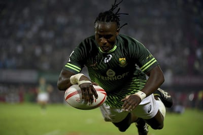South Africa's Seabelo Senatla scores a try against Fiji on the final of the 2016 Dubai Rugby Sevens. Martin Dokoupil / AP Photo