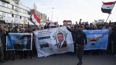 Iraqis carry mock coffins as they take part in a rally to mourn Ahmad Abdessamad, a correspondent for local television station Al-Dijla, and his cameraman Safaa Ghali were shot dead late Friday in Basra. AFP