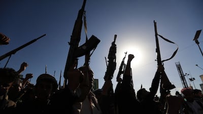 Houthi supporters brandish weapons during a protest against Saudi intervention in Yemen, in Sanaa on October 9. AFP