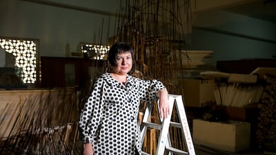 Isabel Carlos, here in front of Spells on our Youth by Diana Al-Hadid, was curator of the Sharjah Biennial in 2009. Nicole Hill / The National