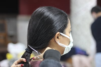 Out of 800 braids of hair received since 2015, the group has provided around 150 wigs. Hasan al-Nade / The National