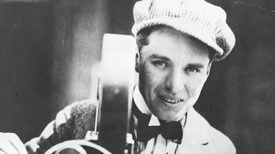 Charlie Chaplin (1889 - 1977) was both an actor and a director, he's pictured here operating a movie camera. Photo by Keystone / Getty Images