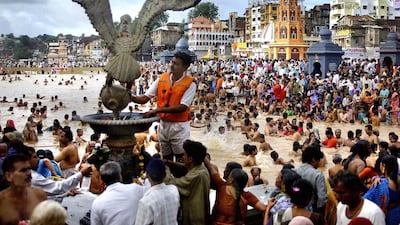 Hindu pilgrims on the banks of the Godavari River at Nashik during the Kumbh Mela festival on August 12, 2003. Organisers who are preparing for the festival that is will open on July 14, 20105 hope to avoid a repeat of a deadly stampede 12 years ago which kille 39 pilgrims Rob Elliott/AFP Photo