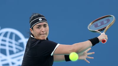 Ons Jabeur hits a backhand during her match against Sonobe Wakana of Japan during the Mubadala Abu Dhabi Open. All photos: Chris Whiteoak / The National