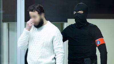 Defendant Salah Abdeslam arrives with a police escort for the trial. AFP