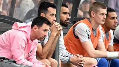 Lionel Messi on the bench in Hong Kong. AFP