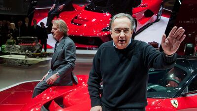 Sergio Marchionne (R), seen with a Ferrari at the 83rd Geneva Motor Show, suffered surgery complications. EPA