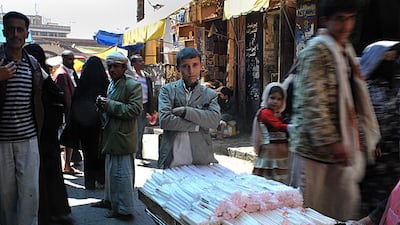 Rashid Adaad, 15, sells candles in Sanaa's Old City 12 hours a day after dropping out of school.