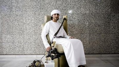 Khalid al Shammari demonstrates his invention at the Abu Dhabi Police headquarters.