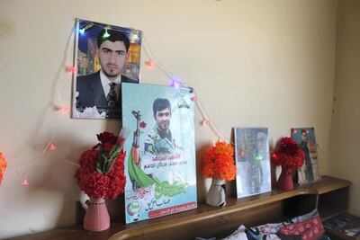 Sahla Al Hasani keeps photographs of her son Sari, who was killed during the military campaign to oust ISIS in 2015. Lizzie Porter/ The National