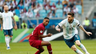 Qatar's Salem Al Hajri, leftm watches as Argentina's Lionel Messi dribbles past him. Argentina won the Group B match 2-0 at Arena do Gremio Stadium in Porto Alegre to advance to the quarter-finals of the 2019 Copa America. EPA