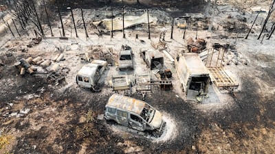 Burnt cars following a wildfire in Gironde's Le Porge commune in France. AFP