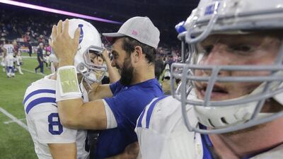 Indianapolis Colts quarterback Andrew Luck congratulates teammate Matt Hasselbeck after the Indianapolis Colts' NFL win over the Houston Texans on Thursday night. Patric Schneider / AP / October 8, 2015