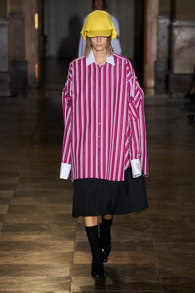 A striped shirt becomes a dress in the Raf Simons spring/summer 2022 collection.