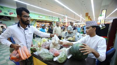 Omanis shop at a supermarket in Muscat. Mohammed Mahjoub / AFP Photo
