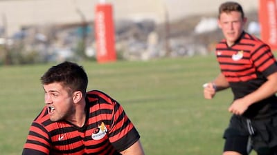 Abu Dhabi Saracens, in red, taking on Abu Dhabi Harlequins at Al Ghazal golf club in Abu Dhabi on March 7, 2014. Ravindranath K / The National