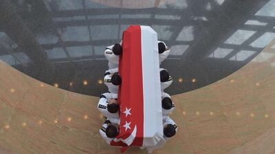 Honour guards carry the coffin bearing Singapore’s former prime minister during his funeral. Adek Berry/AFP Photo
