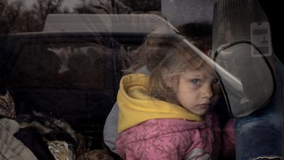 A girl arrives at an evacuation point for people fleeing Mariupol, Melitopol and the surrounding towns under Russian control in 2022. Getty Images