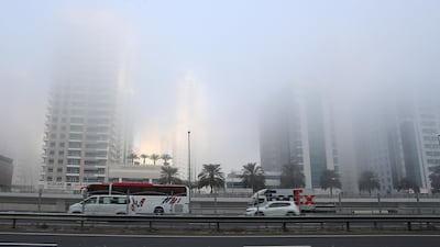 Traffic during the early morning fog on Sheikh Zayed road near Dubai Marina in Dubai. Pawan Singh / The National