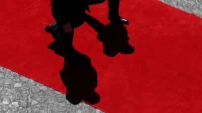 Secretary of state Rex Tillerson, left, and Argentinean foreign minister Jorge Faurie cast shadows as they walk at San Martin Palace in Buenos Aires. REUTERS/Martin Acosta