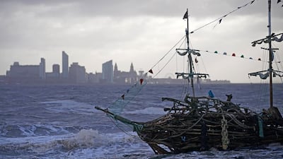 The Pirate Ship art installation, made from driftwood, braves the waves whipped up by the wind of Storm Eleanor. Christopher Furlong / Getty Images