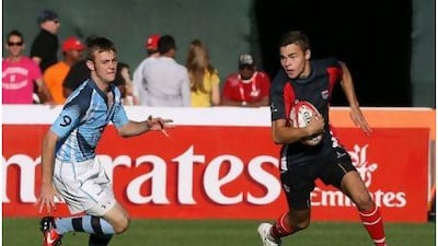 Dubai College's James Capon, right, was one of his team's four try scorers in the final against British School Al Khubairat. Mike Young / The National