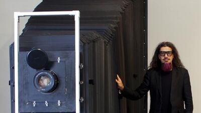 Halim Al Karim stands next to his custom-built Large Format camera. Courtesy of Halim Al Karim and The Robischon Gallery