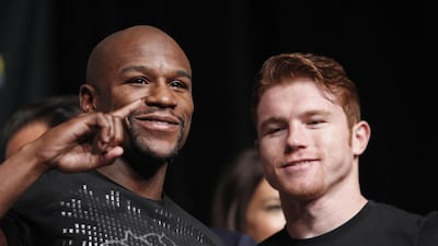 Floyd Mayweather, left, and Saul "Canelo" Alvarez pose during the final news conference Wednesday. The pair are scheduled to fight on Saturday night at Las Vegas for Mayweather's WBA Super World and Alvarez's WBC junior middleweight titles. John Locher / AP Photo
