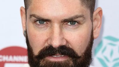 Boyzone's Shane Lynch, who'll be performing with the group on May 22, wants UAE race-car drivers and drifters to tweet him an invite. Tim P Whitby / Getty Images