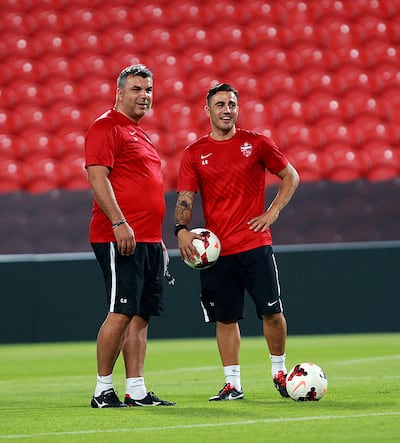 Al Ahli Head Coach Cosmin Olaroiu, left, and Assistant Coach Fabio Cannavaro during a training session at the Mohammed Bin Zayed Stadium in Abudhabi in 2013. Satish Kumar / The National