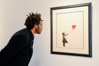 Girl with Balloon by Banksy, displayed in 2021. Getty Images