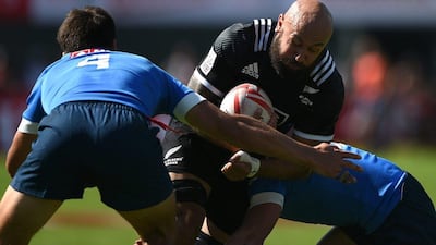 DJ Forbes of New Zealand is tackled during Friday's play at the Dubai Rugby Sevens tournament. Tom Dulat / Getty Images / December 2, 2016
