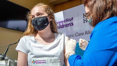 A 14-year-old is inoculated by a nurse in Hartford, Connecticut, US. AFP