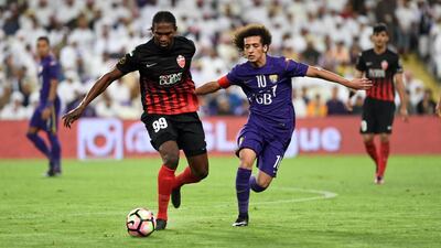 Makhete Diop of Al Ahli, left, holds off Omar Abdulrahman of Al Ain during the Arabian Gulf League football match between Al Ain and Al Ahli at Hazza bin Zayed Stadium in Al Ain on December 31, 2016. Photo Courtesy Arabian Gulf League