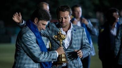 Graeme McDowell comforts Team Europe's captain Jose Maria Olazabal.