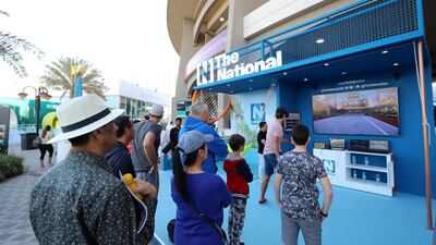 Tennis fans arrive at the International Tennis Centre at Zayed SPorts City in Abu Dhabi.